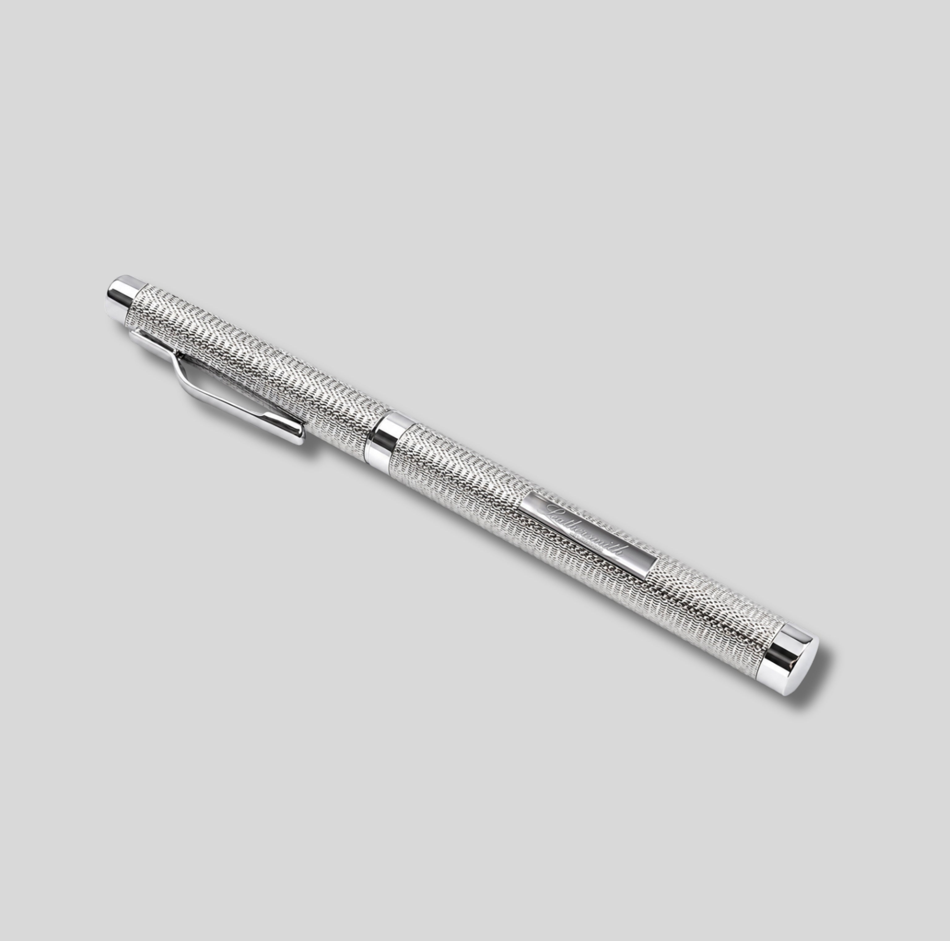 A sterling silver rollerball pen with a textured, barleycorn grip pattern and a polished clip, shown diagonally on a solid light gray background.
